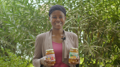 Woman holds jars of healthy jams