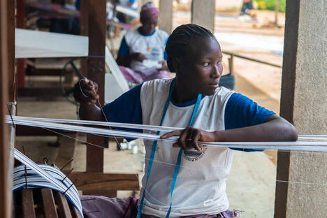 A weaver at work on a Faso Danfani textile, with CABES, EFI’s social enterprise partners in Burkina Faso. 