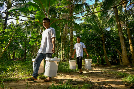 Pasciolco Agri Ventures Philippines carrying buckets