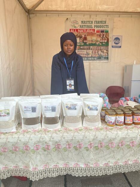 Women in veil shows table of healthy food products