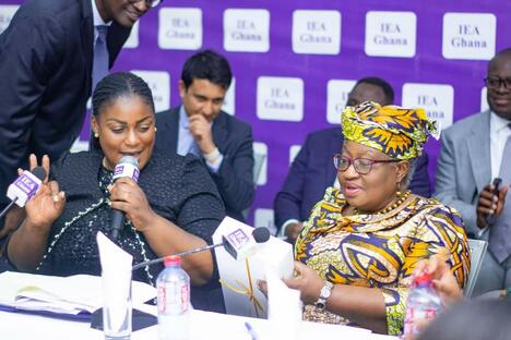 Ngozi Okonjo-Iweala opens box of chocolates in conference room