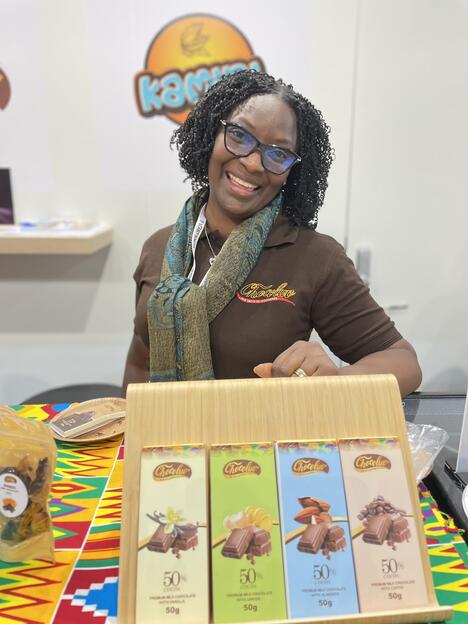Monica Nana Ama Senanu from Chocoluv in Ghana poses with colourfully packaged chocolate bars