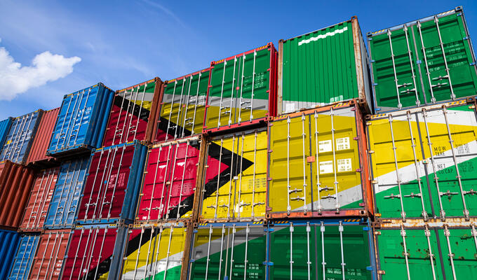 Shipping containers showing Guyana's flag