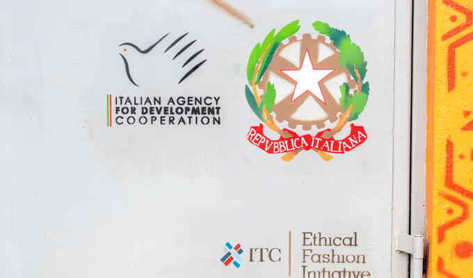 Sign with logos for the Italian Agency for Development Cooperation, the government of Italy and ITC