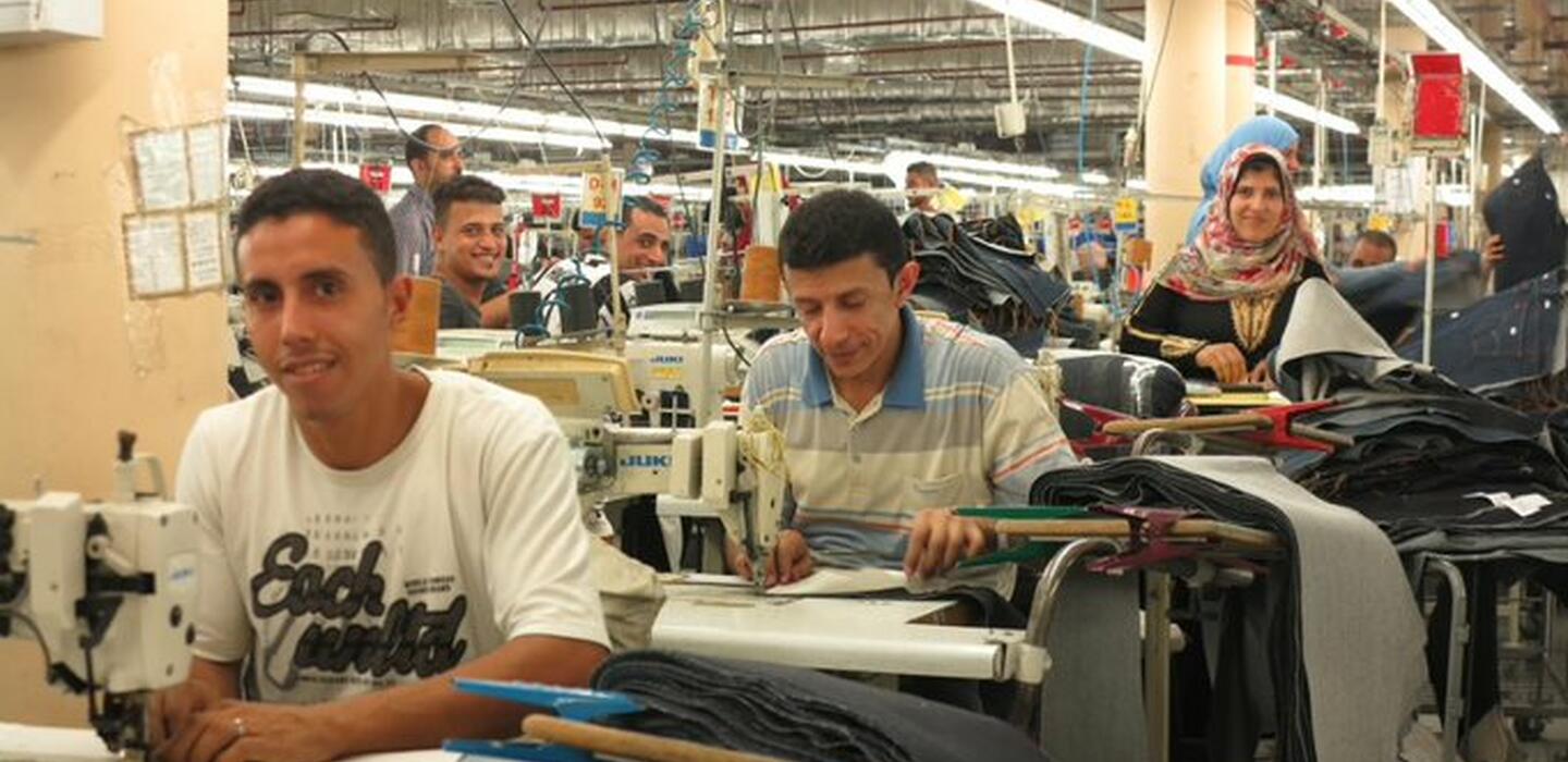 Egyptian employees working in a jeans textile and clothing company