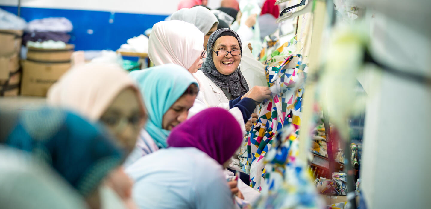 Women organizing finalized clothing pieces in a factory in Morocco 