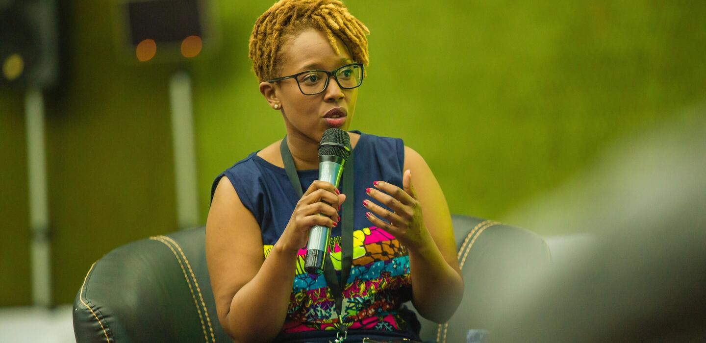 Woman speaking at WEDF in Lusaka