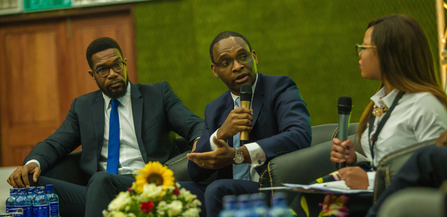 Three people in discussion at the WEDF 2018 in Lusaka
