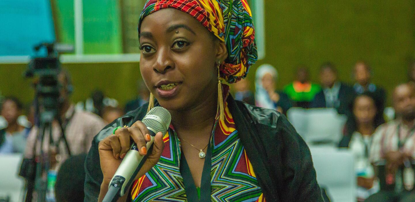 Woman speaking at WEDF 2018 in Lusaka