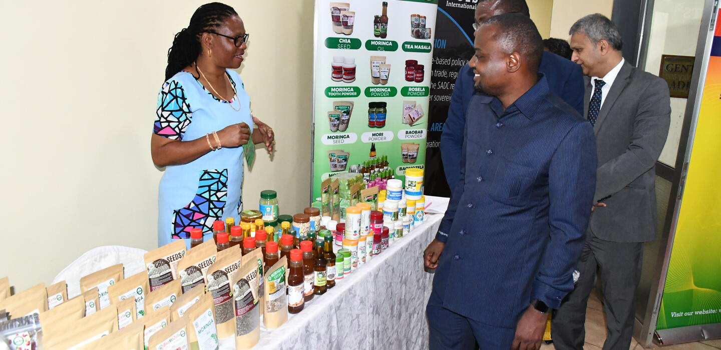 Businesswoman shows her products made from local plants