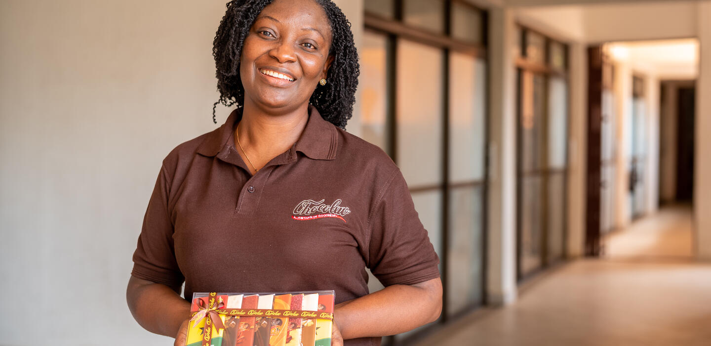 Monica Nana Ama Senanu holds box of Chocolub chocolates