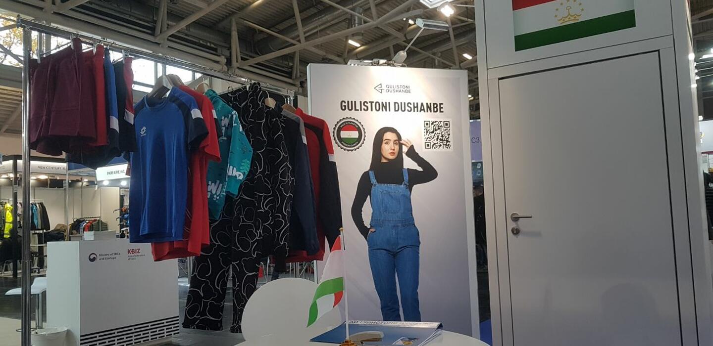 Booth showcasing sportswear made in Tajikistan.