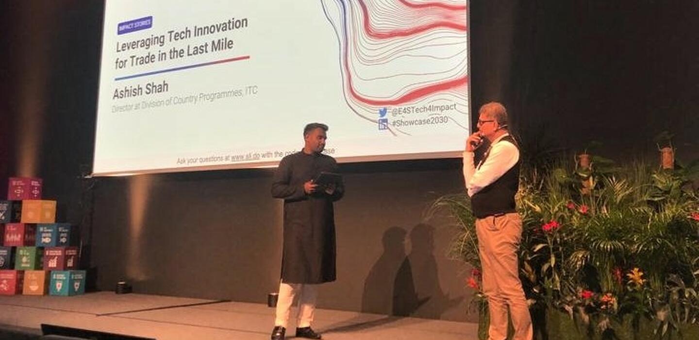 Two men on stage at Showcase 2030 Enterprise for Society