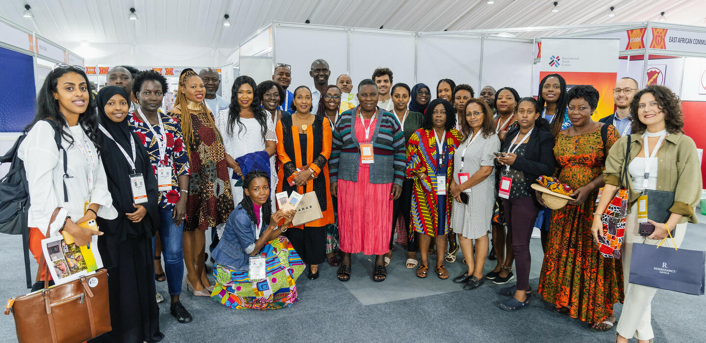 A group photo of ITC Executive Director and the 24 entrepreneurs we supported at the trade fair. 