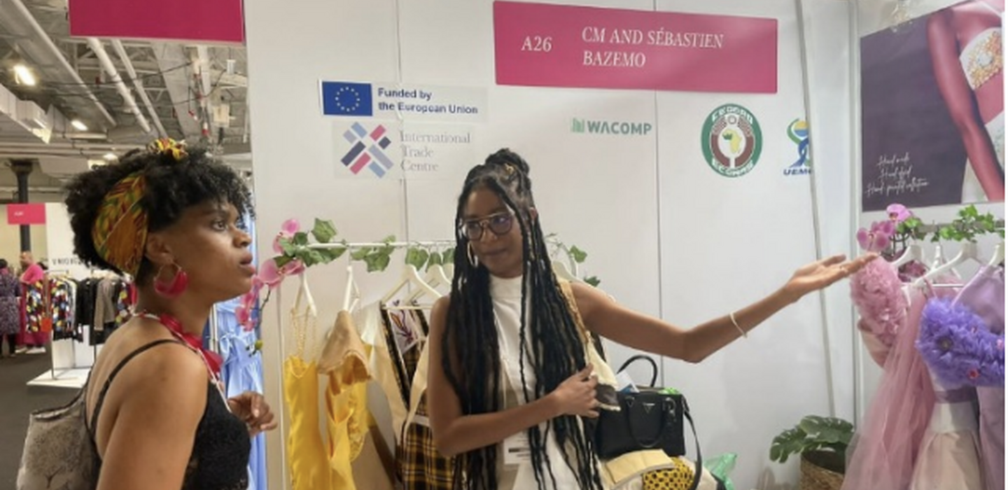 West African clothing maker shows dresses at a trade fair