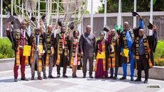 Group of graduates in Ghana throwing their hats